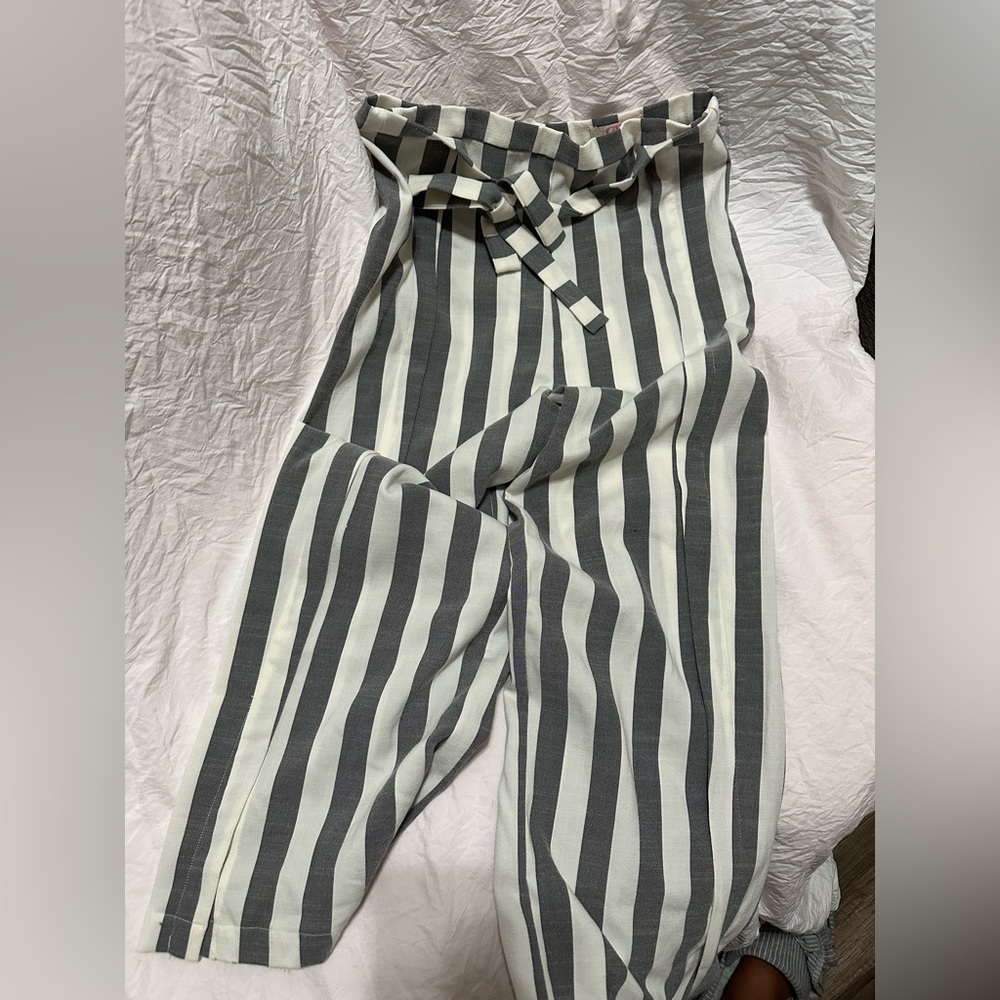 Grey and white plaid pants. With a bow you can put in the front and back.